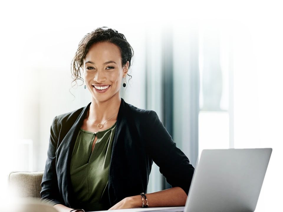 Professional woman with laptop next to her.