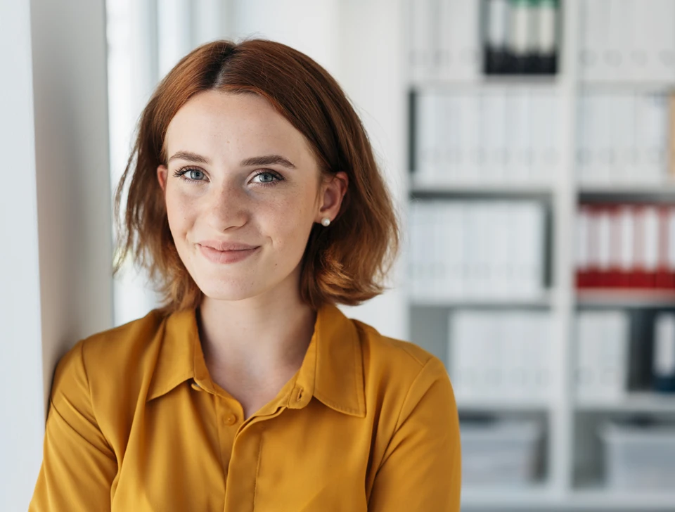 A woman smiling at the camera.
