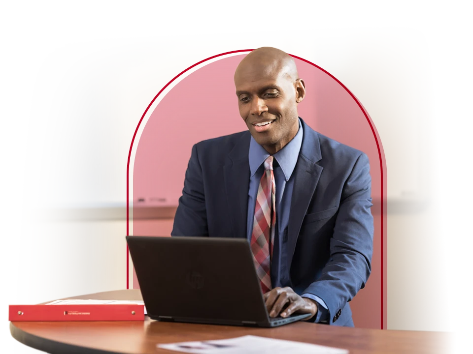 A businessman works on his laptop. 