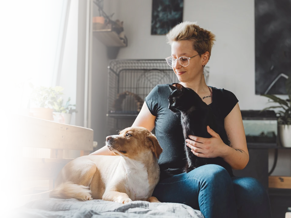 A family laughing at a television.