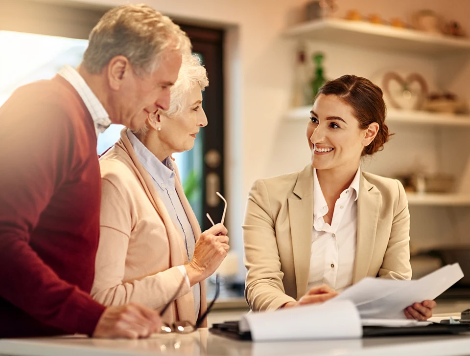 A man and his wife talking to a professional.