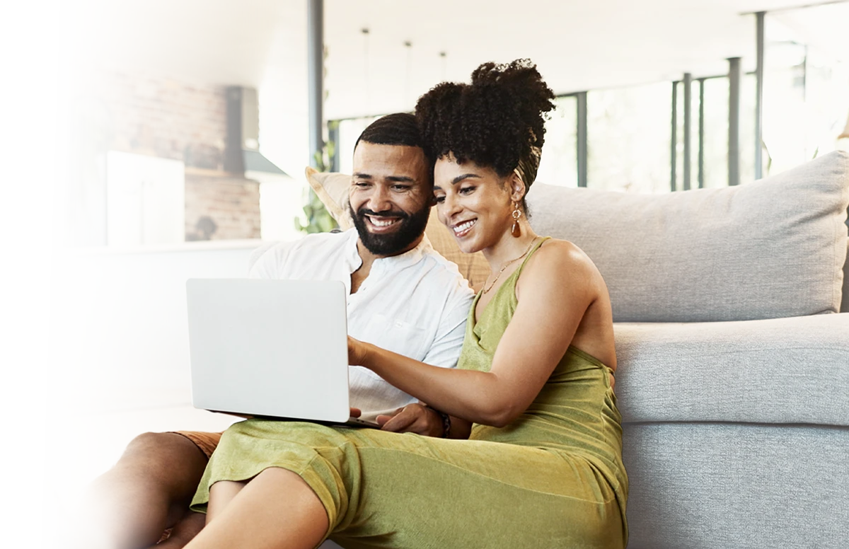 A mom and her daughter doing yoga.